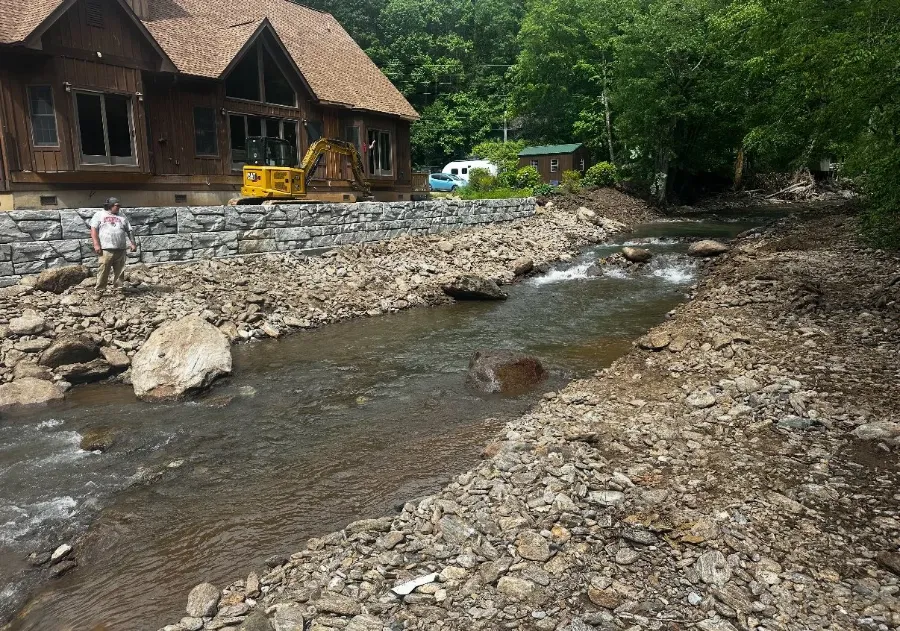 Creek channel restored beside a cabin