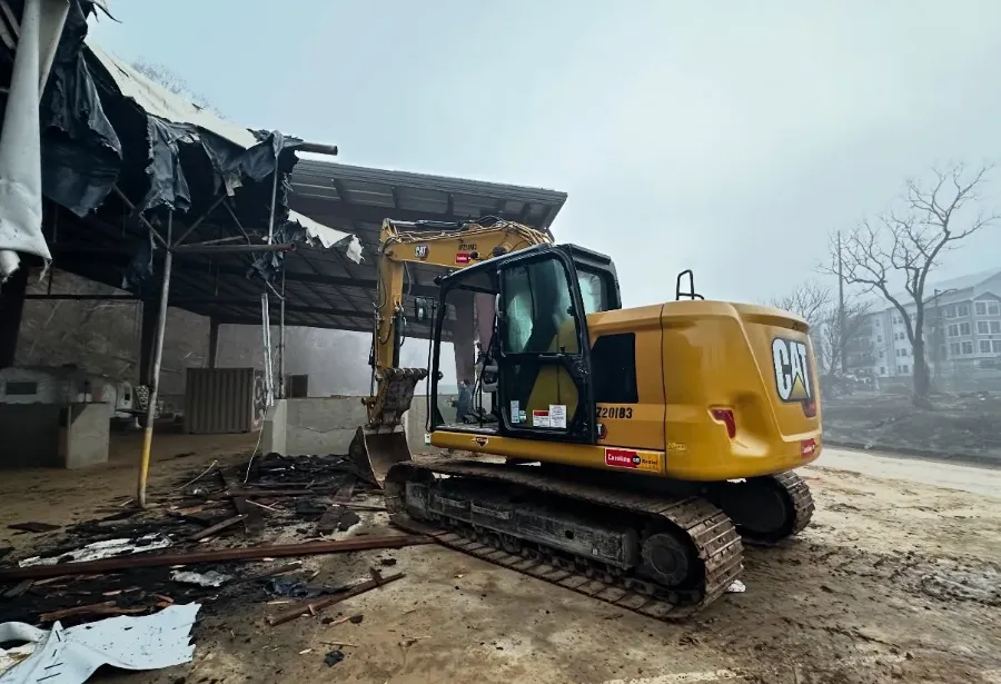 Excavator demolishing a building