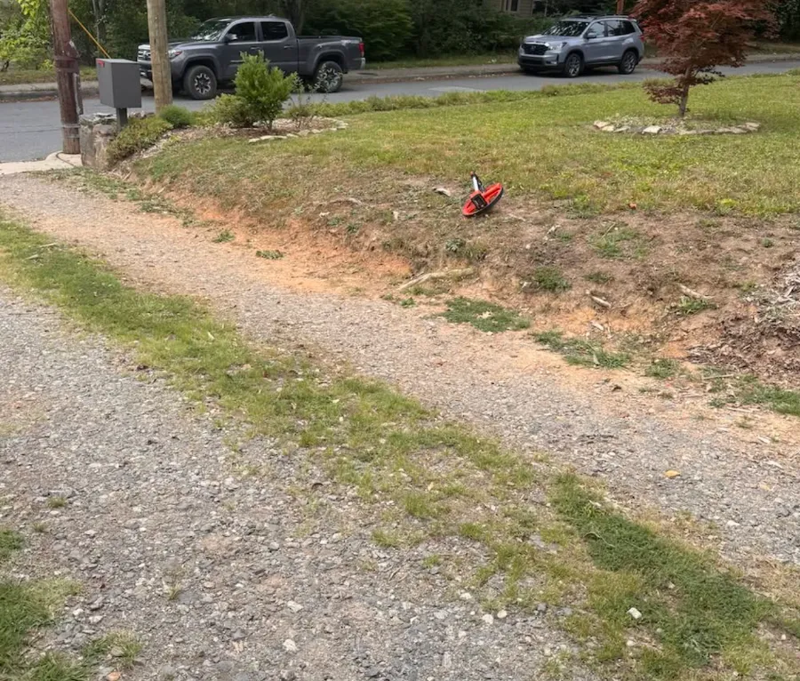 Worn gravel drive before it was rebuilt