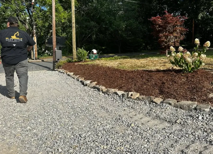 Rebuilt gravel drive with mulched edges