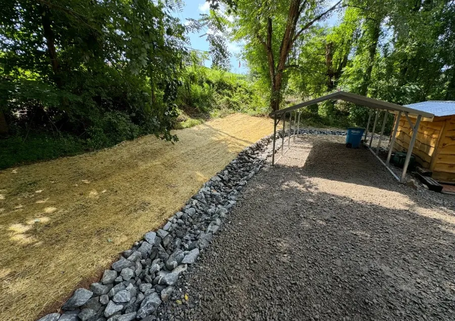 Gravel drive with a rock-lined drainage edge