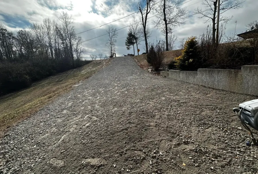 Gravel driveway climbing a hillside