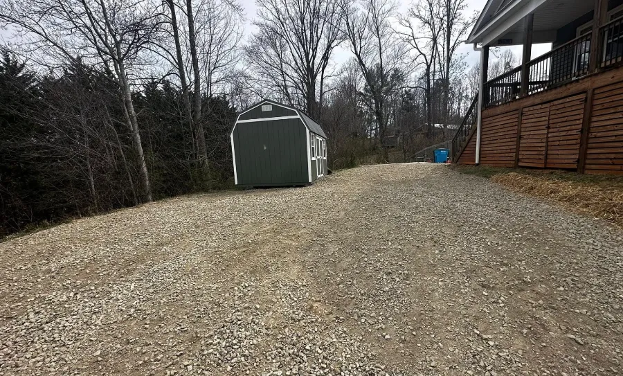Gravel parking pad and shed