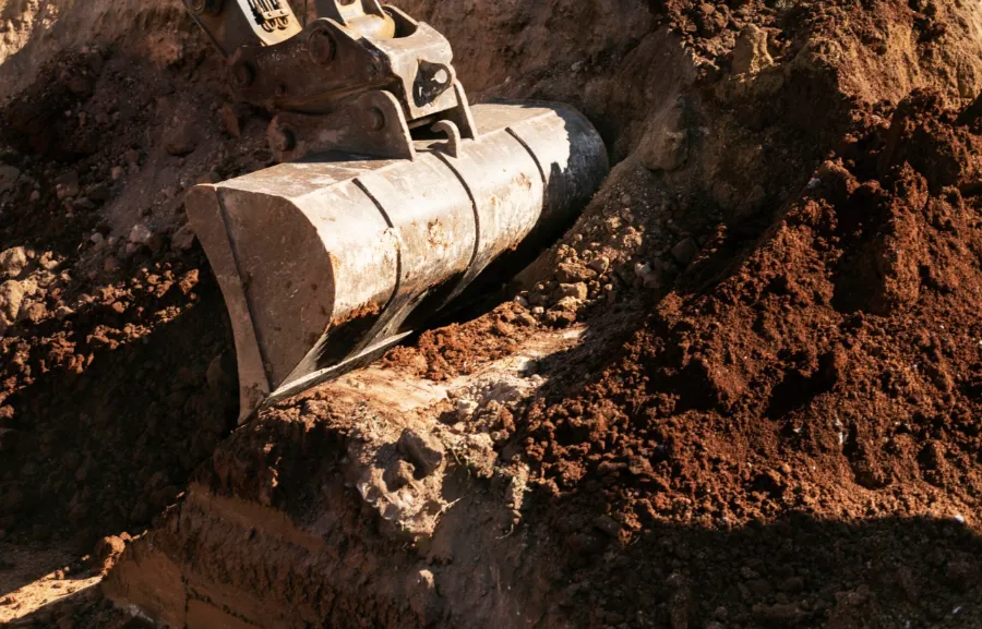 Pipe being set in a trench